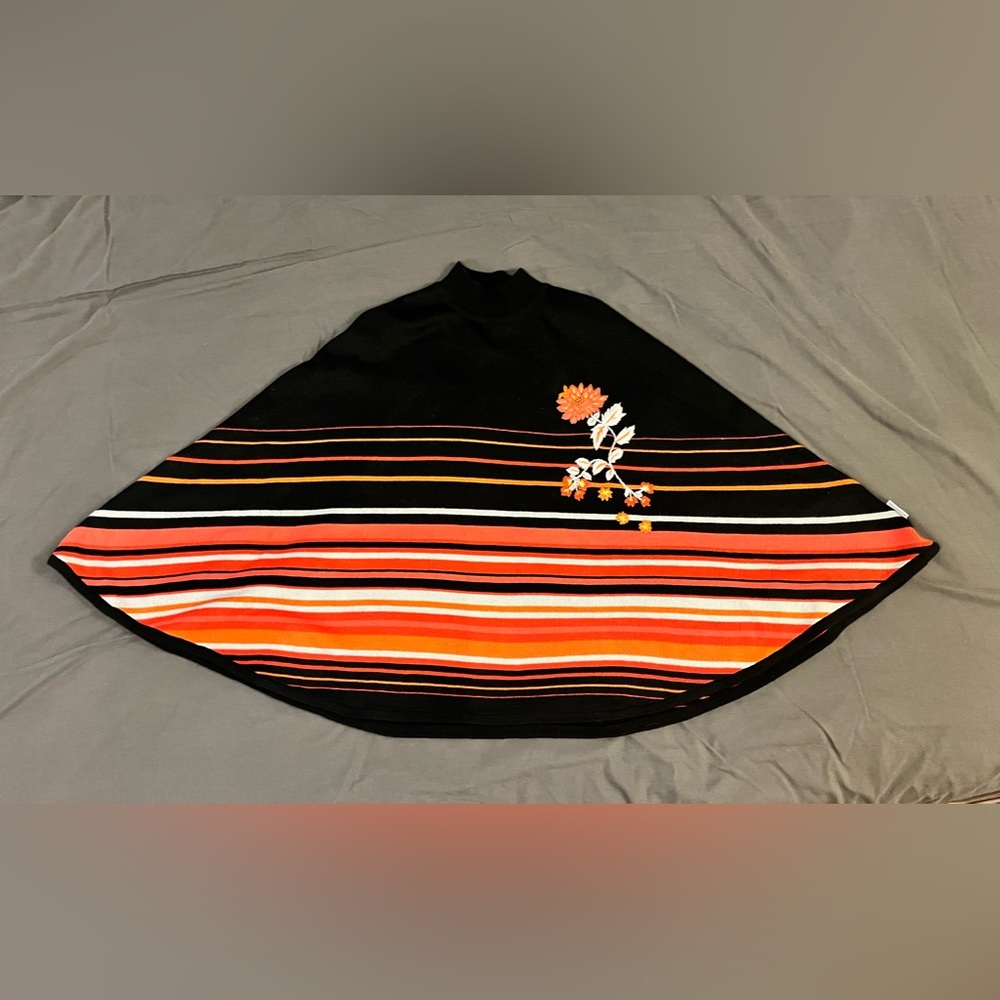 Patagonia Water Girl Wool Blend Poncho in Black with varying pinks. One Size